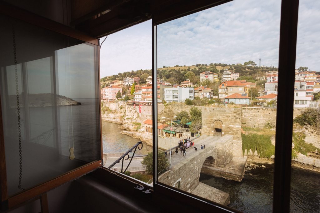 The Roman bridge framed by the veranda windows